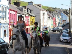 Horse riding through Dingle Town